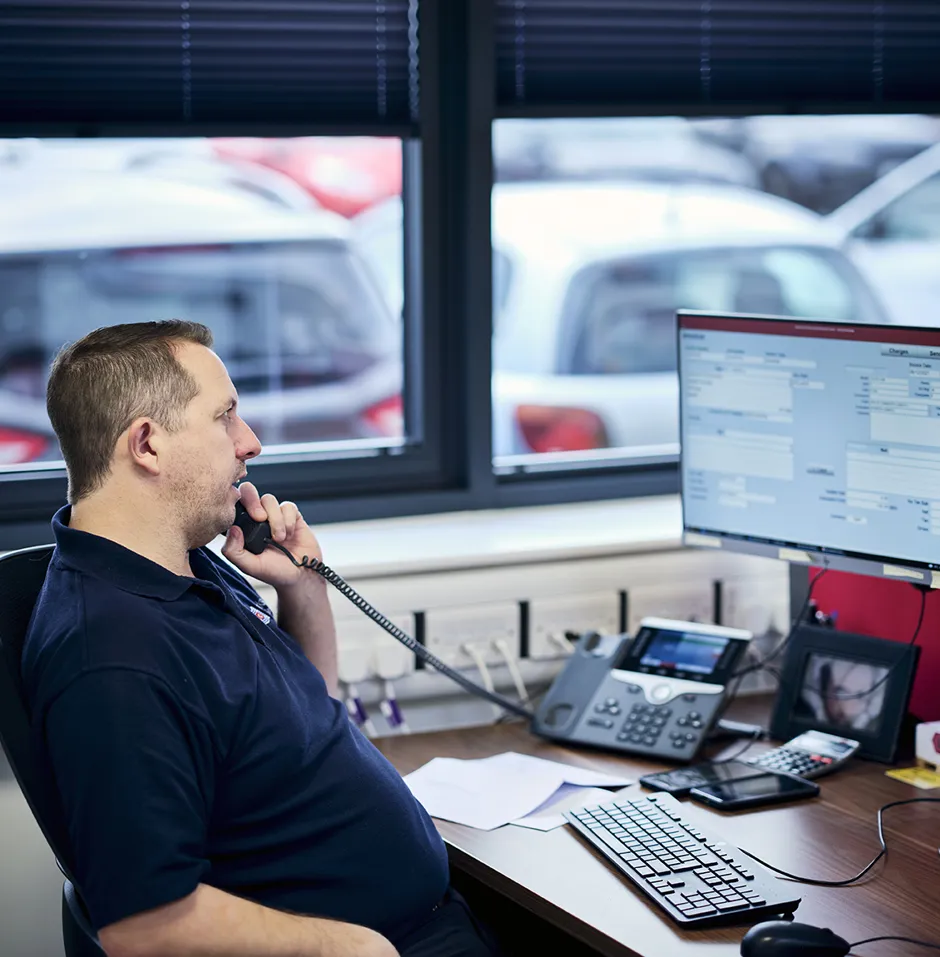 Freight operator at work on the phone
